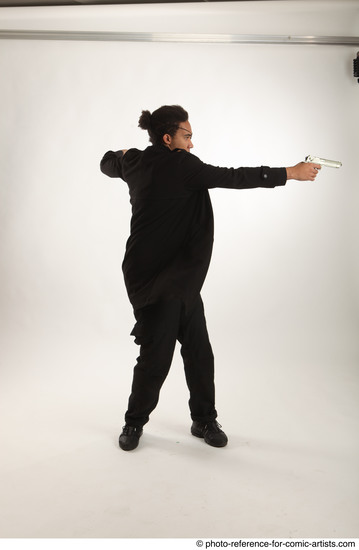 Man Adult Average Black Fighting with gun Standing poses Coat