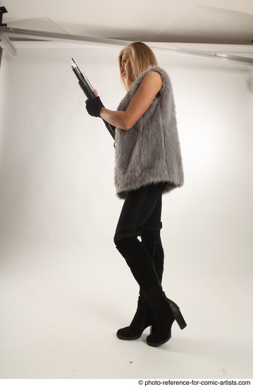 Woman Adult Average White Fighting with gun Standing poses Coat