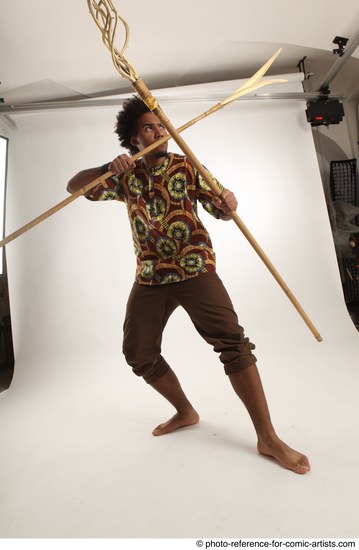 Man Adult Average Black Fighting with spear Standing poses Coat