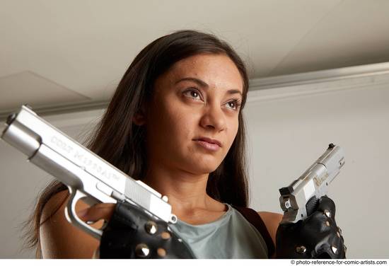 Woman Adult Average Fighting with gun Standing poses Casual Latino