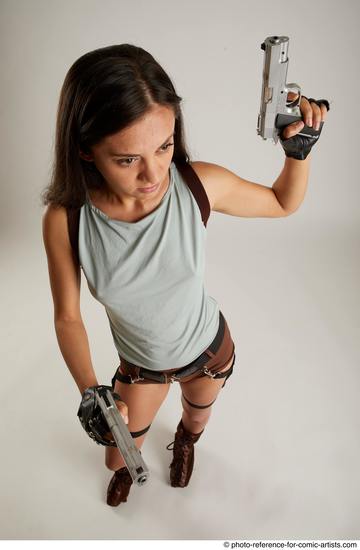 Woman Adult Average Fighting with gun Standing poses Casual Latino