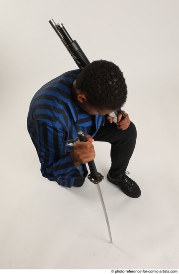 Man Adult Average Black Kneeling poses Casual Fighting with shotgun