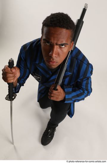 Man Adult Average Black Kneeling poses Casual Fighting with shotgun