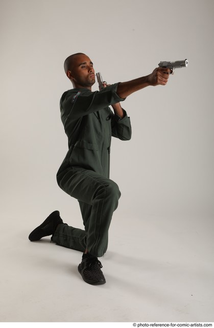 Image of A Young Indian Man Holding Gun or Pistol And Posing On an Isolated  White Background-PA275916-Picxy