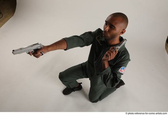 Man Adult Average Black Fighting with gun Kneeling poses Casual