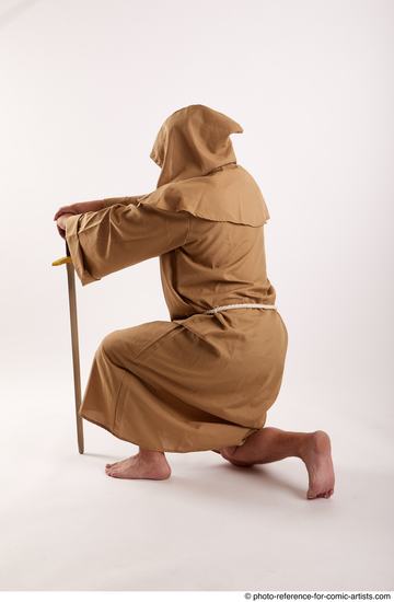 Man Adult Chubby White Neutral Kneeling poses Coat