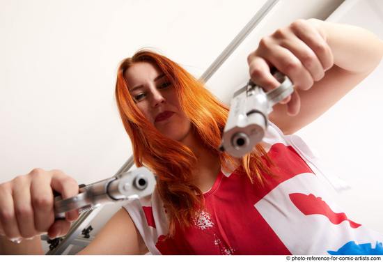 Woman Adult Average White Fighting with gun Standing poses Casual