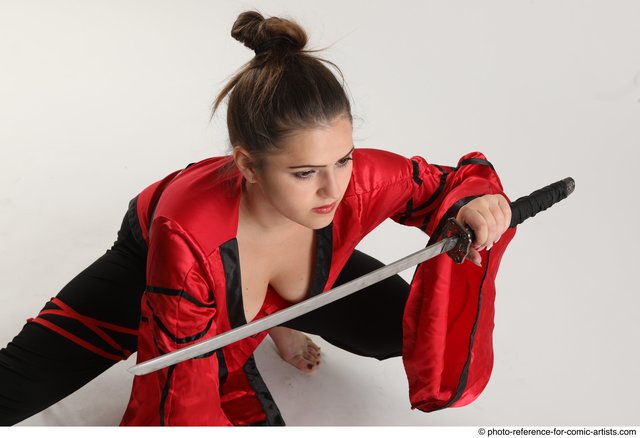 a female ninja holding a sword with both hands