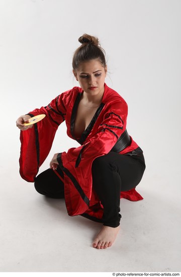 Woman Adult Average Martial art Sitting poses Coat Latino