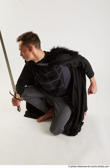 Man Adult Athletic White Fighting with sword Kneeling poses Coat