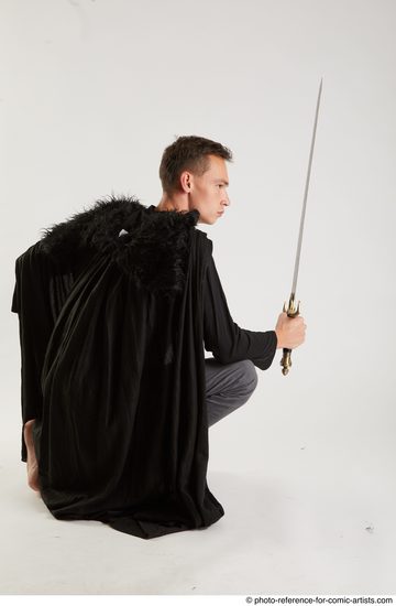 Man Adult Athletic White Fighting with sword Kneeling poses Coat