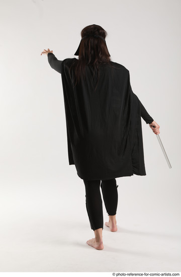 Woman Adult Average White Fighting with sword Standing poses Coat