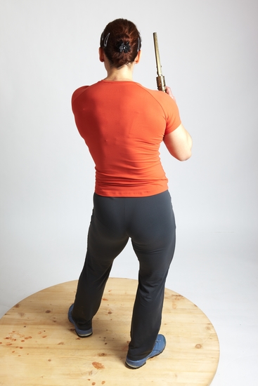 Woman Adult Average White Fighting with gun Standing poses Casual