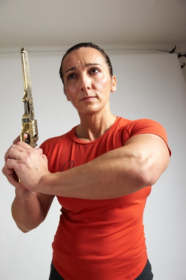 Woman Adult Average White Fighting with gun Standing poses Casual