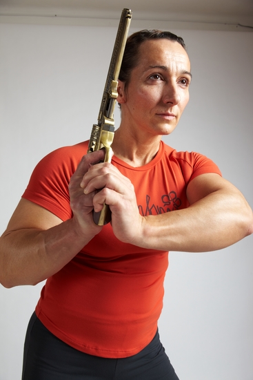 Woman Adult Average White Fighting with gun Standing poses Casual