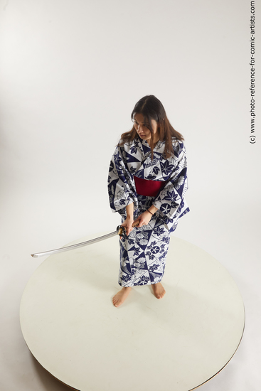 Woman Young Athletic Fighting with sword Asian Costumes