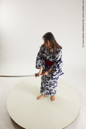 Woman Young Athletic Fighting with sword Asian Costumes