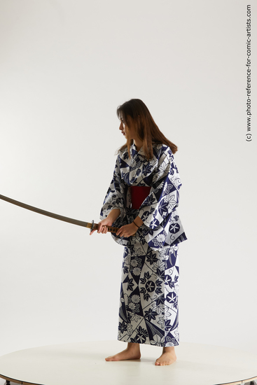 Woman Young Athletic Fighting with sword Asian Costumes