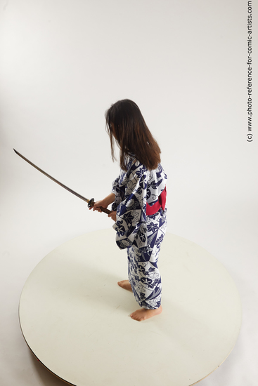 Woman Young Athletic Fighting with sword Asian Costumes