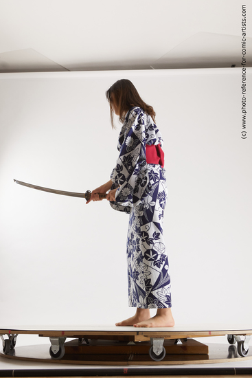 Woman Young Athletic Fighting with sword Asian Costumes