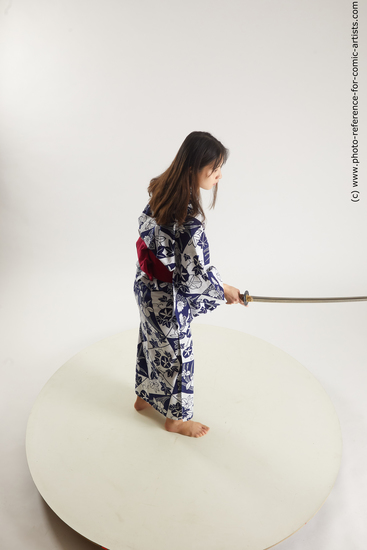 Woman Young Athletic Fighting with sword Asian Costumes