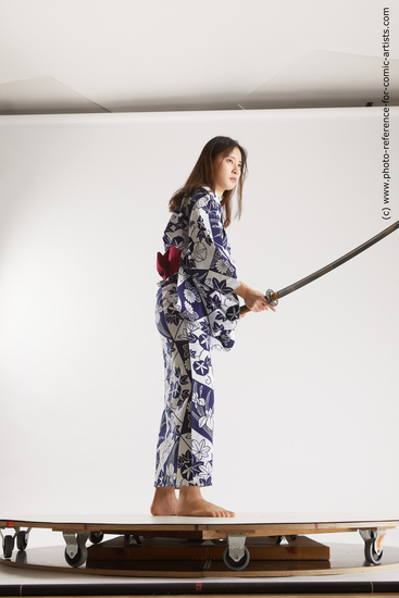 Woman Young Athletic Fighting with sword Asian Costumes