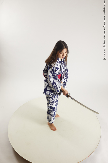 Woman Young Athletic Fighting with sword Asian Costumes