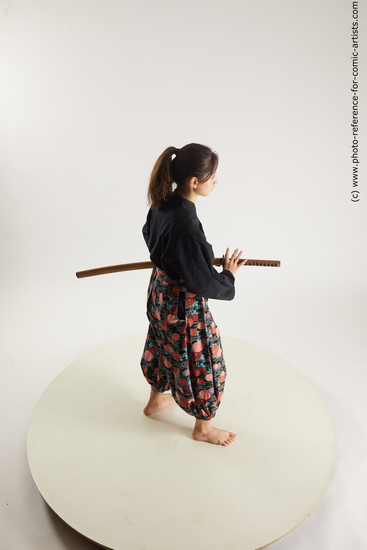 Woman Young Athletic Fighting with sword Standing poses Asian Costumes