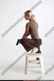 IVA KNEELING ON CHAIR SHOOTINGDOWN