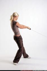 Woman Young Athletic White Fighting with sword Moving poses Sportswear