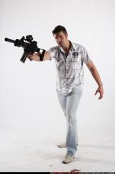 Man Adult Average White Fighting with submachine gun Standing poses Casual