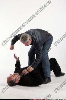 men-fist-fighting-on-ground