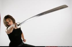 Woman Adult Average White Fighting with sword Standing poses Casual