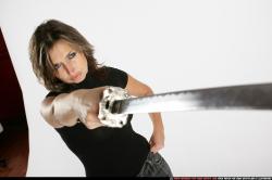 Woman Adult Average White Fighting with sword Standing poses Casual