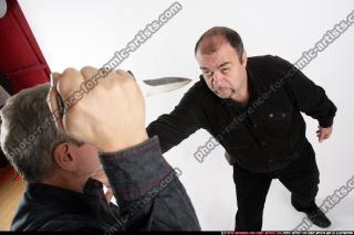 men-knife-fight