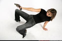 Woman Adult Athletic White Fighting with gun Crouching Casual