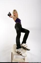 Woman Adult Athletic White Fighting with gun Moving poses Sportswear