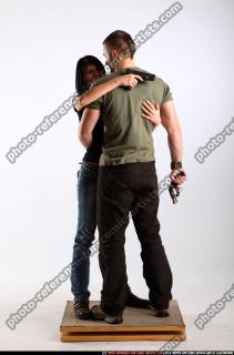 2010 01 COUPLE HUGGING GUNS 00 B