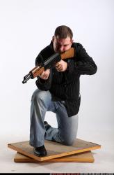 Man Adult Chubby White Fighting with submachine gun Kneeling poses Casual