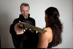 Adult Muscular White Fighting with gun Standing poses Casual