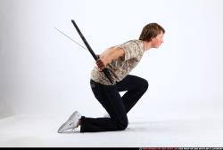 Man Young Athletic Another Fighting with sword Kneeling poses Sportswear