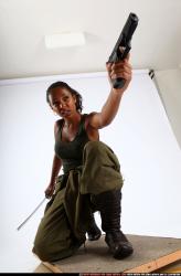 Woman Young Athletic Black Fighting with gun Kneeling poses Army