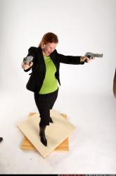 Woman Adult Average White Fighting with gun Standing poses Business