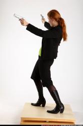 Woman Adult Average White Fighting with gun Standing poses Business