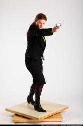 Woman Adult Average White Fighting with gun Standing poses Business