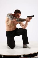 Man Adult Athletic White Fighting with gun Kneeling poses Pants