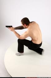 Man Adult Athletic White Fighting with gun Kneeling poses Pants