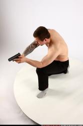 Man Adult Athletic White Fighting with gun Kneeling poses Pants