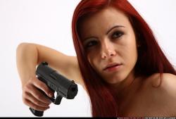 Woman Young Athletic White Fighting with gun Kneeling poses Casual