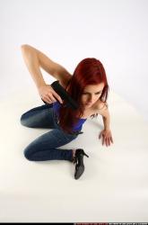 Woman Young Athletic White Fighting with gun Kneeling poses Casual